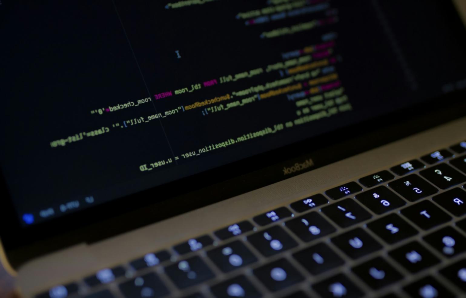 Professional developer workspace with trading software and custom indicator code
