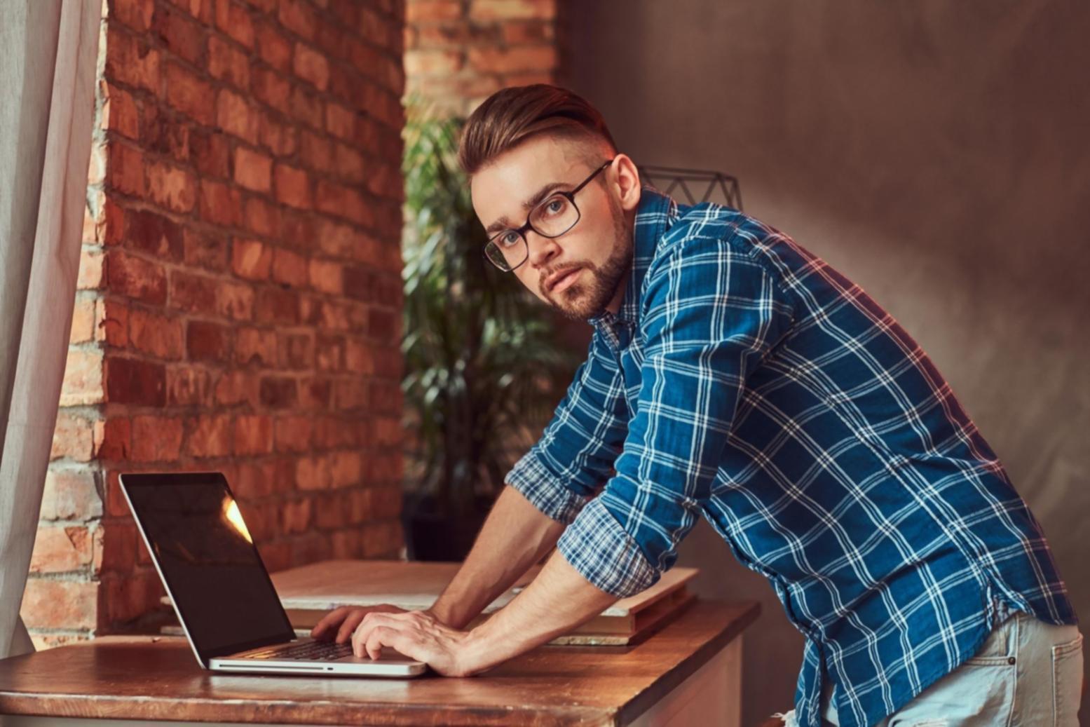 Professional mobile app support workspace with development tools and testing devices